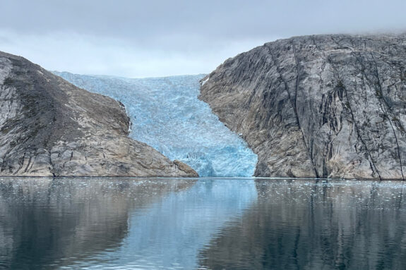 A glacier flows into a fjord in the southwest coast of Greenland.