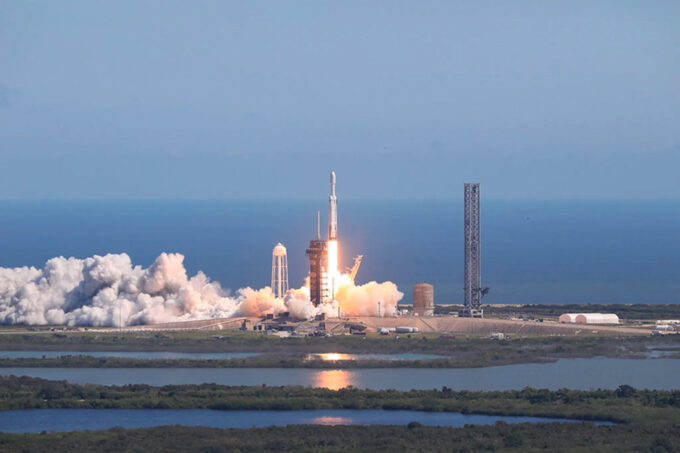 A large rocket lifts off from a NASA launchpad next to Florida's Atlantic coast.