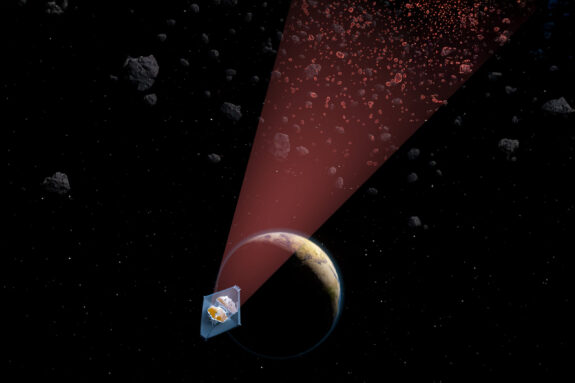 Illustration of the James Webb Space Telescope shining light on a population of small asteroids.