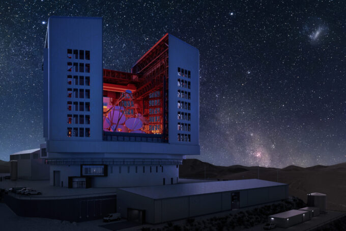 Rendering of the Giant Magellan Telescope, located in a mountain setting with many stars at night.