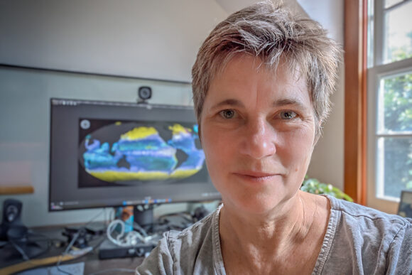 Stephanie Dutkiewicz in front of computer display