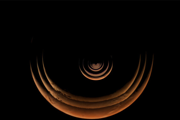 A sequence of images of Mars in crescent phase growing larger that were taken as the Psyche spacecraft approached Mars.