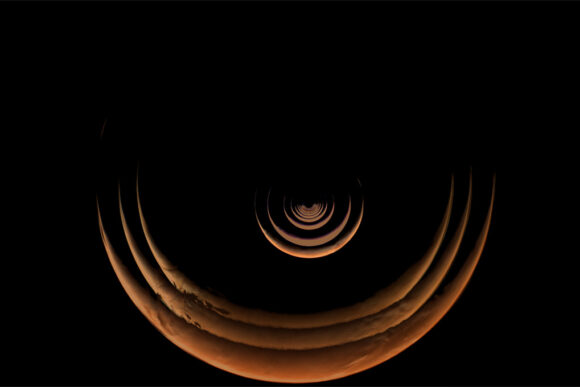 A sequence of images of Mars in crescent phase growing larger that were taken as the Psyche spacecraft approached Mars.