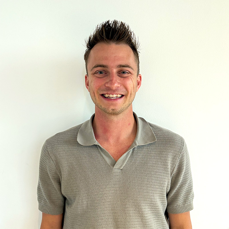 A headshot of Alex Moger