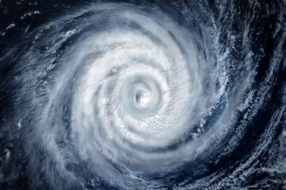 Swirling clouds of a well-defined cyclonic storm seen from space.