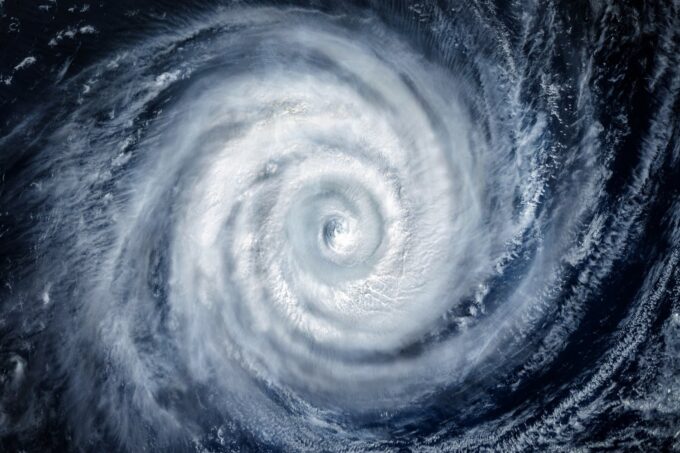 Swirling clouds of a well-defined cyclonic storm seen from space.